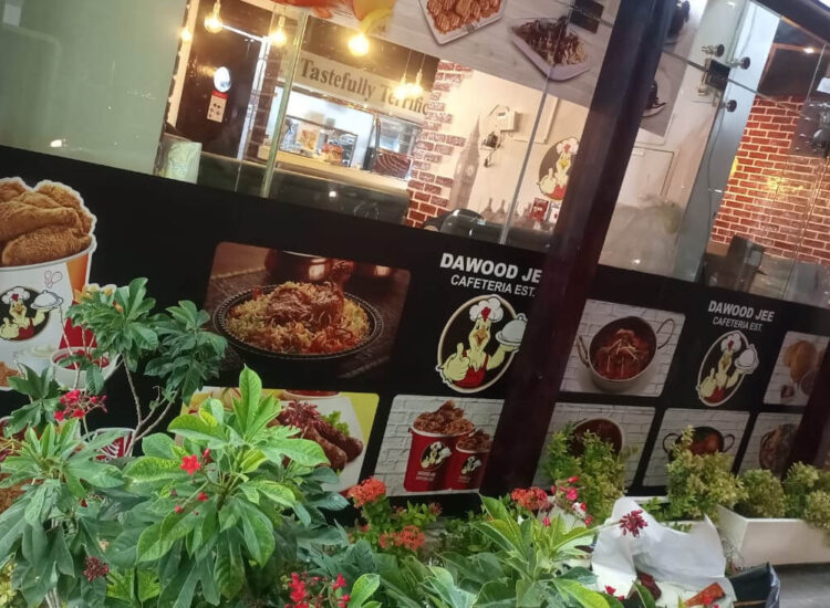 Dawood Jee Glass Print